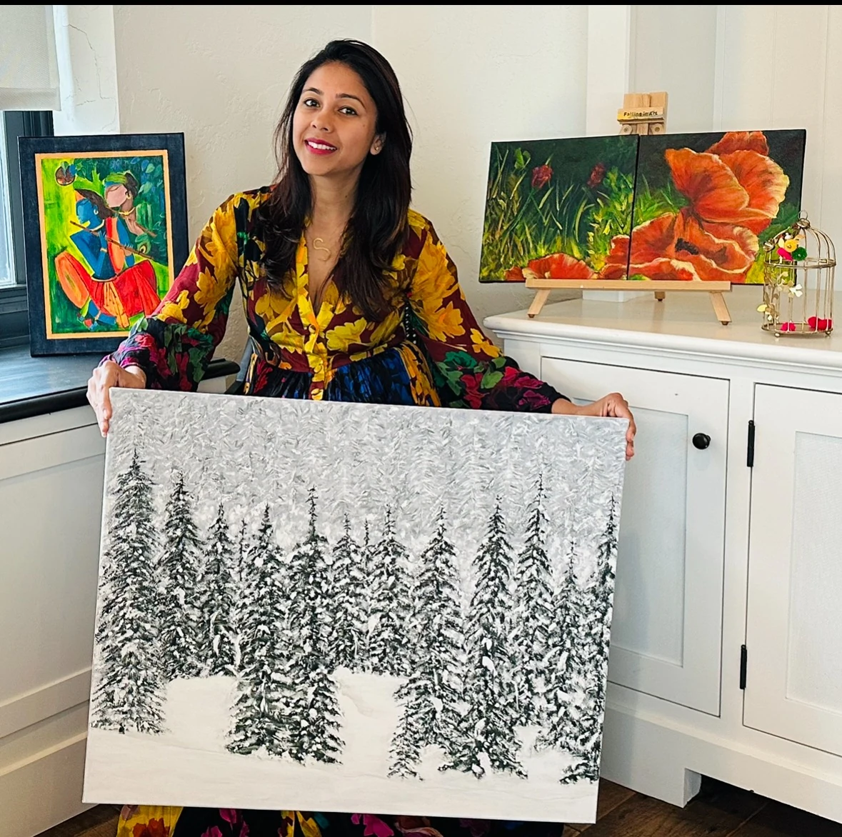 Shivani Khanna Vohra in her studio surrounded by original paintings